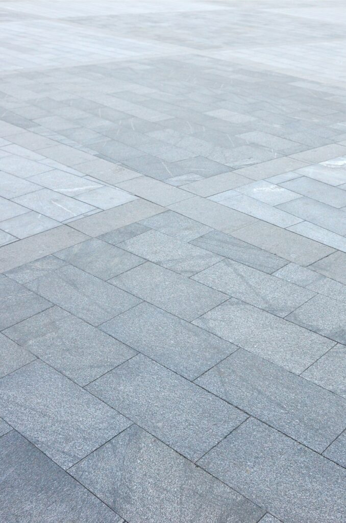 Fragment of the square paved of a large granite tiles
